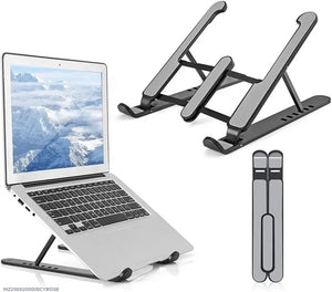 A dual laptop stand shown in three views: supporting a silver laptop on a raised platform, folded flat, and shown with a vertical side view. The stand is black and gray with a matte finish, set against a plain white background.